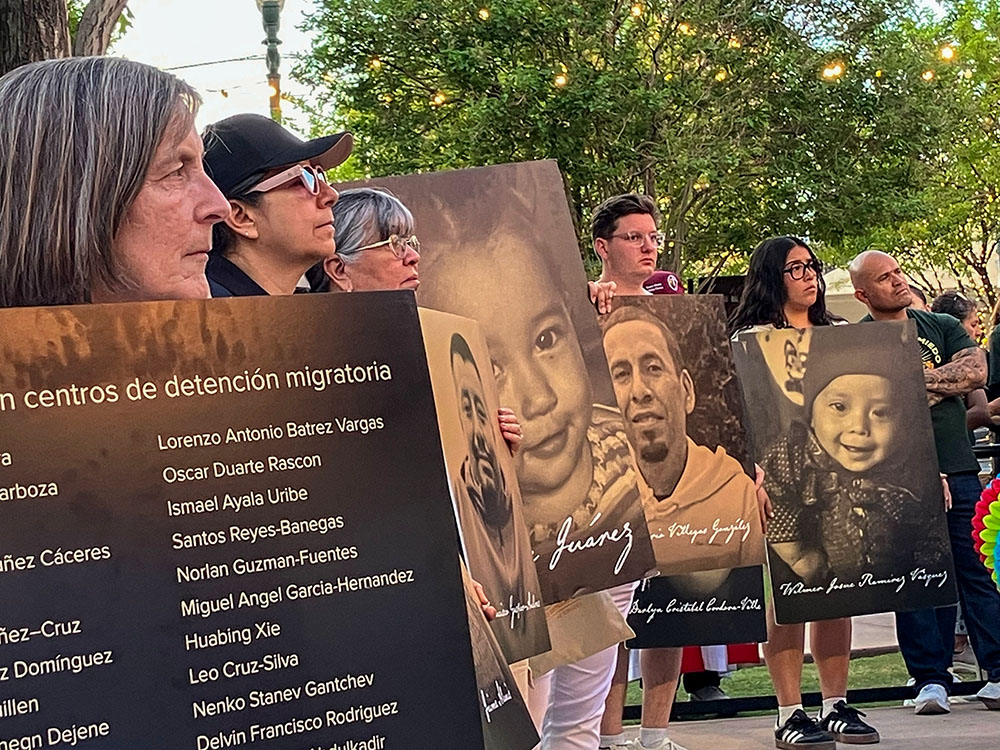 Demonstrators hold placards with photographs and names of people who died in immigration-related circumstances as they take part in a protest in El Paso, Texas, March 24, 2026, against mass deportations and the immigration policies of the Trump administration. (NCR photo/Elvira Ramirez).