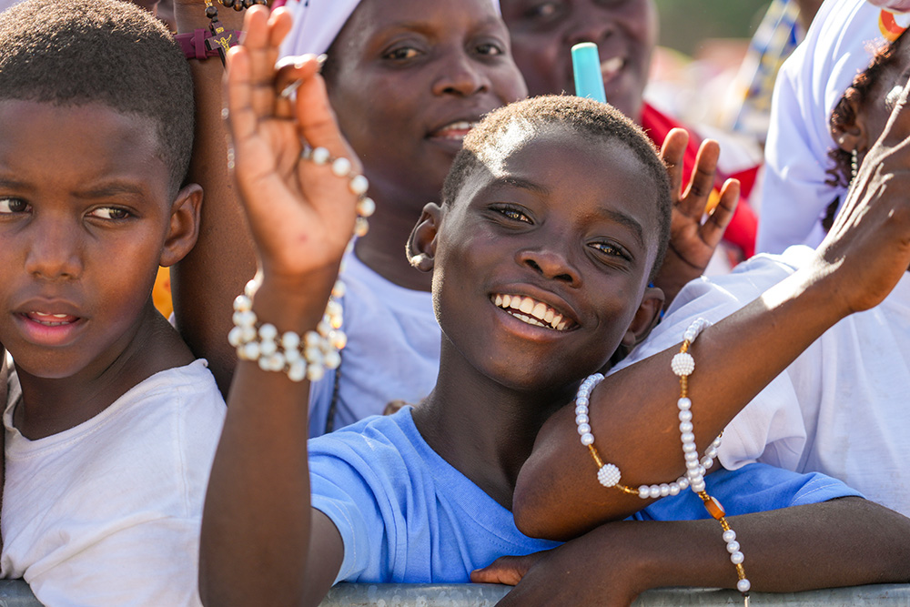 Children and others smile as they attend a prayer service with Pope Leo XIV at the Sanctuary of Our Lady of Muxima in Muxima, Angola, April 19, 2026. (CNS/Lola Gomez)