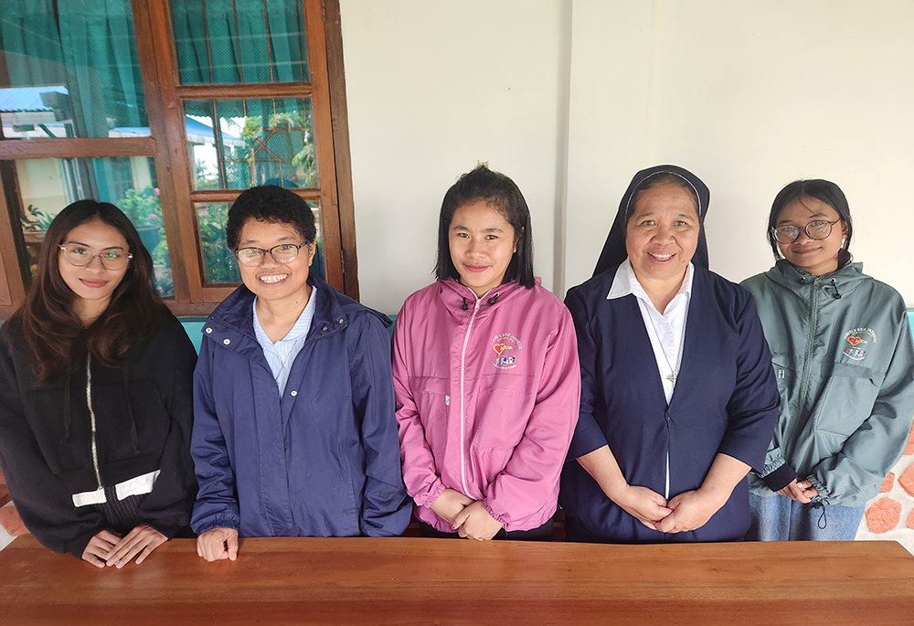 The staff of Good Shepherd Social Services in Ruteng, Indonesia, pose for a photo: From left to right, Eka Batmomolin; Good Shepherd Sr. Gabriella Mahos; Matildis Janu; Good Shepherd Sr. Flora Nirmala; and Giodaliva (GSR photo/Chris Herlinger) 