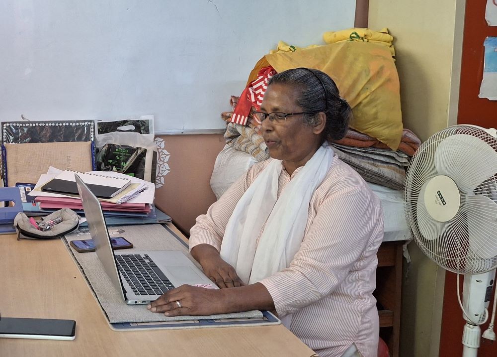 Sr. Connie Callista, a member of the Holy Cross Sisters of Chavanod, sits at the Praytek office in Mayur Vihar on the outskirts of New Delhi, India. (Lissy Maruthanakuzhy)