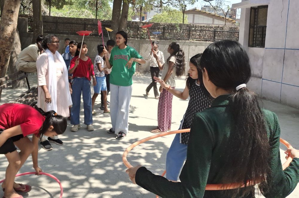 Sr. Connie Callista, a member of the Holy Cross Sisters of Chavanod, supervises children practicing SOCUS art at Trilokpuri, an enclave in East Delhi. (Lissy Maruthanakuzhy)