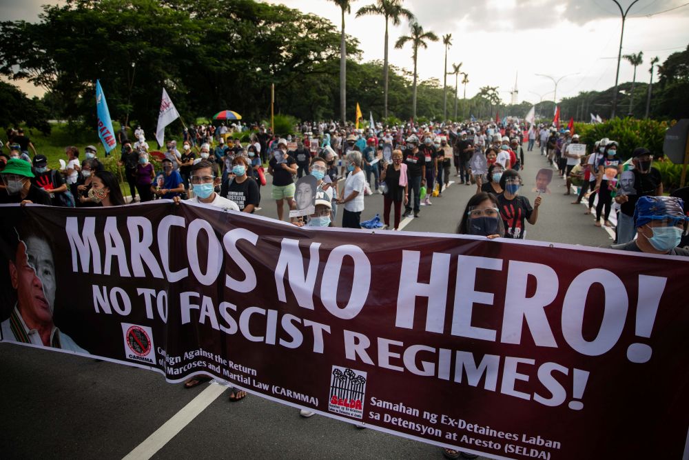 Filipinos carry a banner during a protest in Manila Sept. 21, 2020, the 48th anniversary of martial law, imposed by the late dictator Ferdinand Marcos Sr. (CNS/Reuters/Eloisa Lopez)