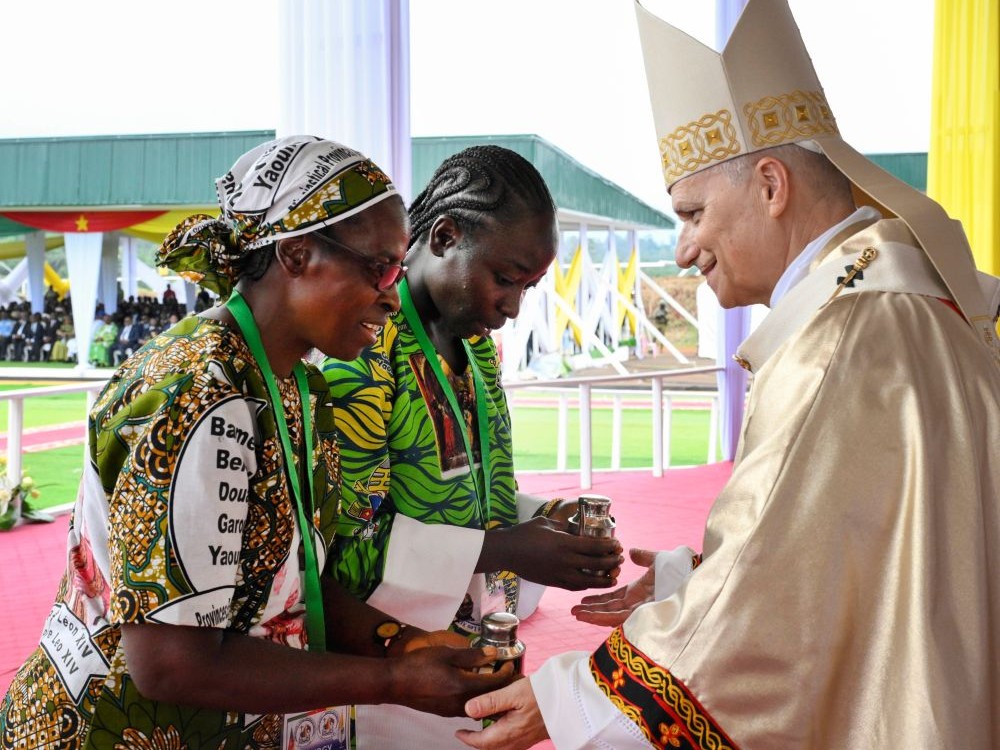 Pope Leo XIV receives the offertory gifts as he celebrates Mass at Bamenda International Airport in Cameroon April 16, 2026. (OSV News/Vatican Media/Simone Risolutii)