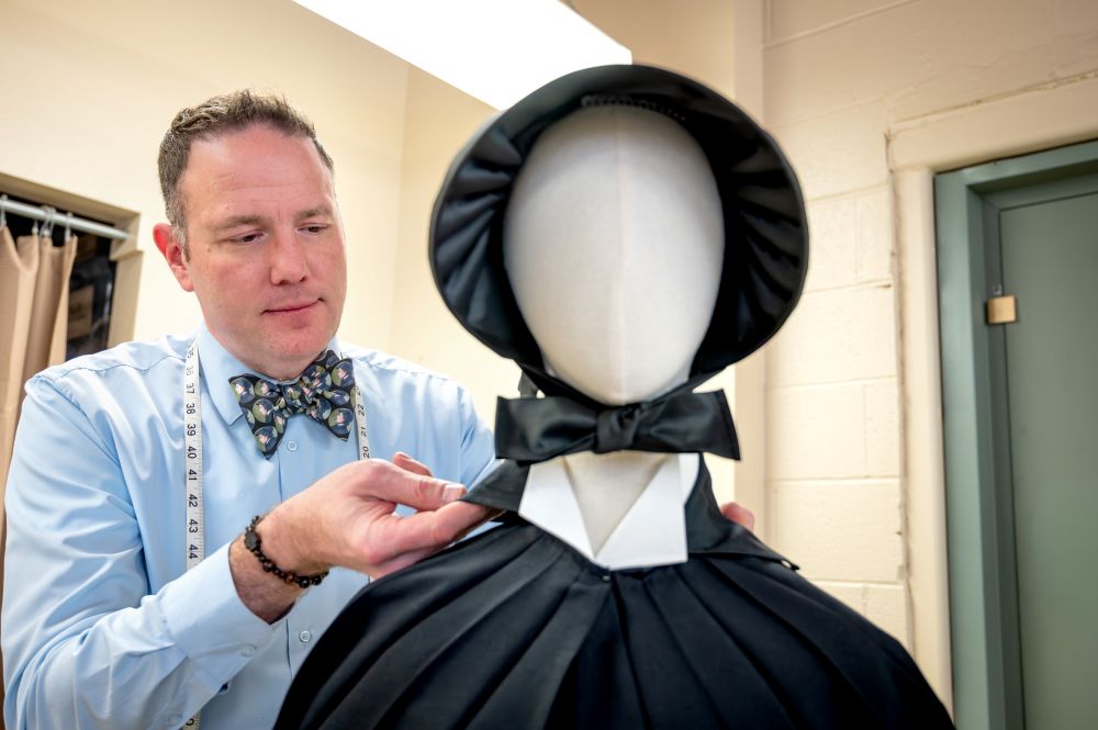 Darrin Pufall Purdy, theater professor at Boise State University, fixes a replica of a habit the Sisters of Charity of New York wore in the 1950s in an undated photo. Pufall Purdy's research on the habits of women religious led him to advise and design costumes for Broadway. (Courtesy of Darrin Pufall Purdy/Priscilla Grover) 
