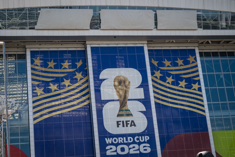 Signage on the exterior of AT&T Stadium, which will be named Dallas Stadium during the 2026 FIFA World Cup, is covered by workers as preparations continue at the venue ahead of the soccer tournament May 28, 2026, in Arlington, Texas. (AP/Jessica Tobias)