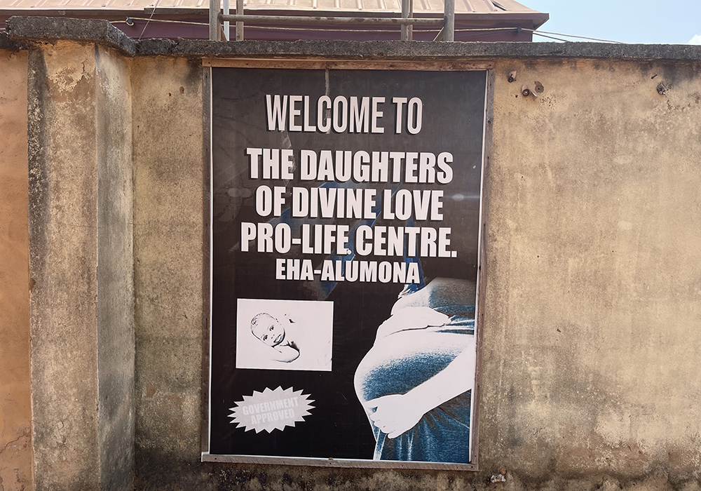 A sign outside for the Daughters of Divine Love Pro-Life Centre is mounted on the facility’s perimeter wall in Eha-Alumona, Nigeria. (John Chukwu)
