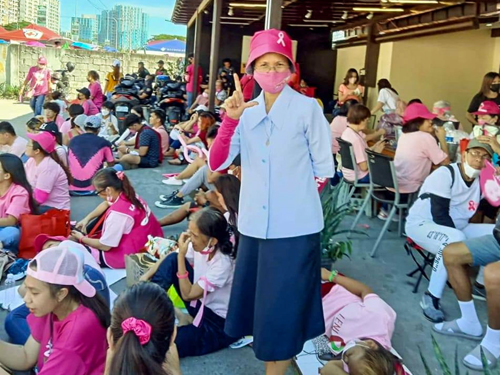 Daughters of Charity Sr. Liza Ruedas flashes an "L" (laban or "fight") sign during a voter's education campaign and gathering in April 2022. (Courtesy of Liza Ruedas)