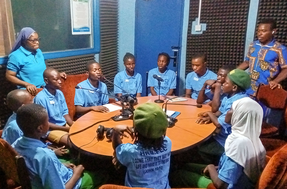 Child Rights Watch Club members of St. Helena's Secondary School, Dockyard Community, and King Fahad Islamic Secondary School, Wellington, both in Freetown, Sierra Leone, take part in a radio discussion on children's issues Nov. 26, 2025. (Courtesy of Misean Cara Ireland/NLW Germany)