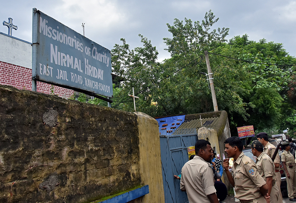 Indian police stand outside the premises of the Missionaries of Charity home in Ranchi, where Sr. Concelia Baxla, 62, was arrested July 5, 2018, on suspicion of child trafficking. (CNS/Reuters)