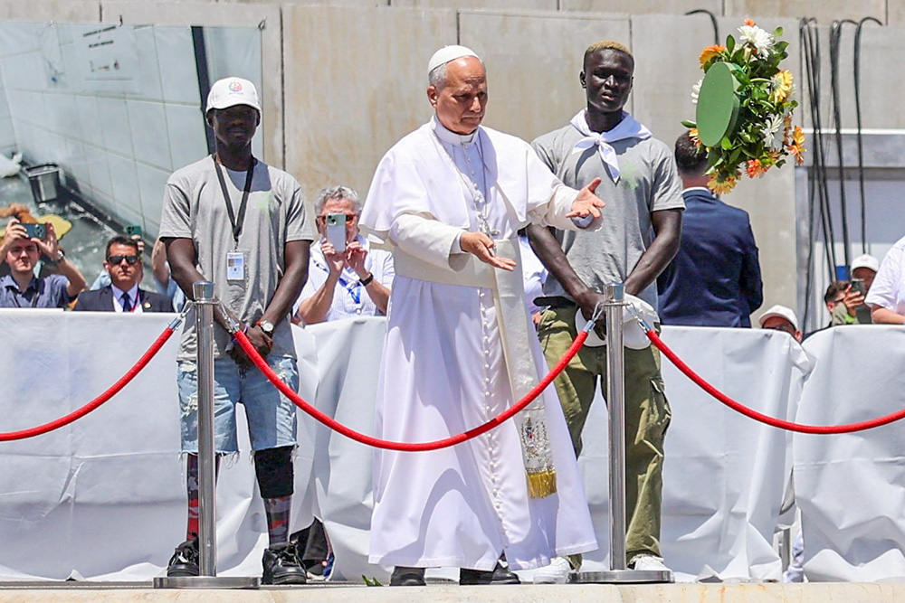 Pope Leo XIV makes a floral offering to migrants lost at sea at the dock of the Port of Arguineguin in Gran Canaria, Spain, June 11, 2026. (OSV News/Reuters/Yara Nardi)