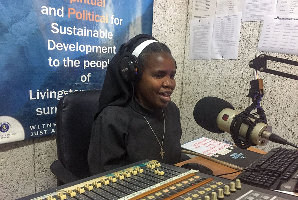 Sr. Perpetua Namasiku Mutonga, a member of the Little Sisters of St. Francis and the founder of Tumelo Catholic Media, evangelizes and shares messages of faith at Livingstone's Radio Musi-O-Tunya. (Derrick Silimina)