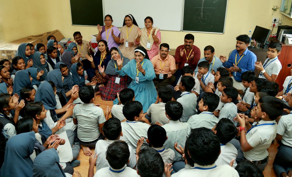 Sacred Heart Sr. Treesa Palackal, founder of Hrudayaram, a counseling center managed by the Sacred Heart Sisters at Kannur, conducts an empowerment camp on Aug. 8, 2019, for children of Puthumala, a village devastated by a landslide earlier that year. (Courtesy of Rincy Augustine)