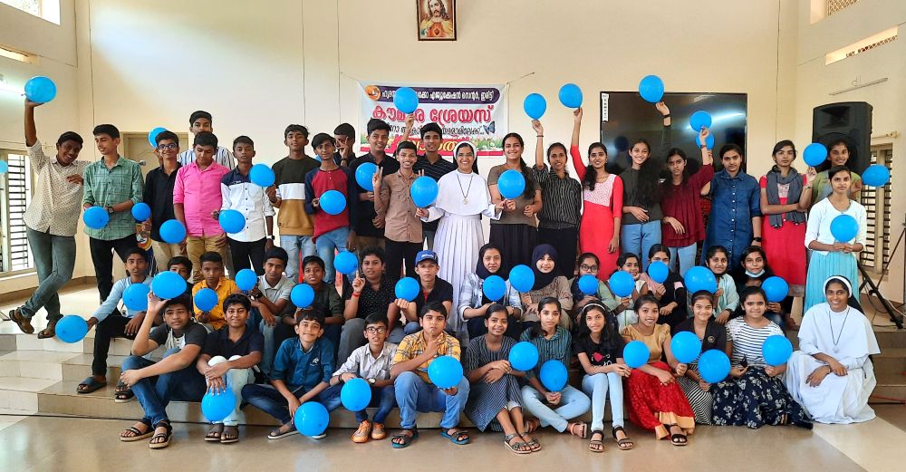 Sacred Heart Srs. Rincy Augustine and Jyothis Palackal stand with students during a "Smart Teens" program held at the sisters' Psycho-Education Centre in Iritty, a town in the Kannur district of the southwestern Indian state of Kerala. (Courtesy of Rincy Augustine)