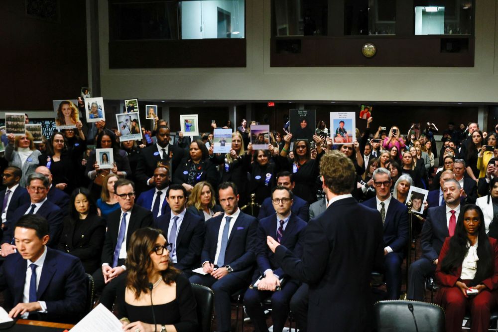 Meta's CEO Mark Zuckerberg stands and faces the audience holding up photos of their children as he testifies during the Senate Judiciary Committee hearing on online child sexual exploitation at the U.S. Capitol in Washington Jan. 31, 2024. (OSV News/Reuters/Evelyn Hockstein)