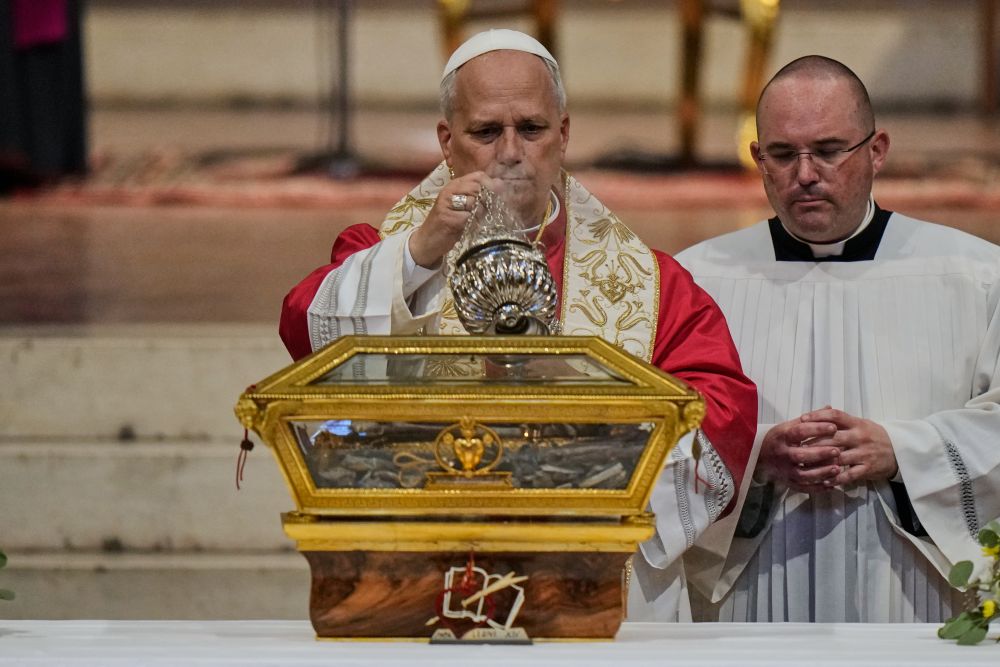 Pope Leo XIV incenses the relics of St. Augustine as he visits the San Pietro in Ciel d'Oro Basilica in Pavia, northern Italy, June 20, 2026. (AP/Luca Bruno)