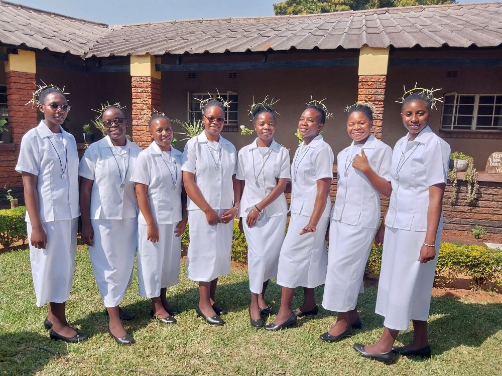 Members of the Congregation of the Handmaids of the Blessed Virgin Mary pose during their reception into the novitiate on July 2, 2025. They are, from left, Gift Miyoba, Alice Nyirenda; Mutinta Nyambe; Annette Mumba, Maimbo Hamoonga, Catherine Mwanza, Monica Mutale and Aoration Chilekwa Chishimba. (Courtesy of Prisca Chuzu)