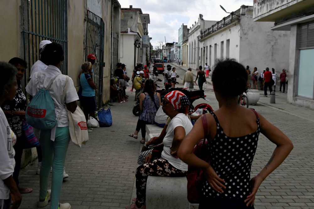 People wait in line to enter a bank branch in Havana, as Cubans from all walks of life hunker into survival mode, navigating seemingly interminable blackouts and soaring prices for food, fuel and transport as the United States increases pressure on the communist-run nation Jan. 26, 2026. (OSV News/Reuters/Norlys Perez)