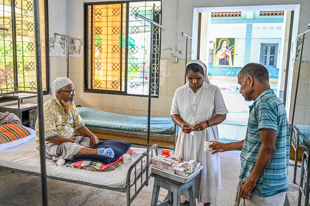 Sr. Sujatha Kattula distributes daily medication. Multidrug therapy is the standard treatment used to cure the disease. (Piyas Biswas)