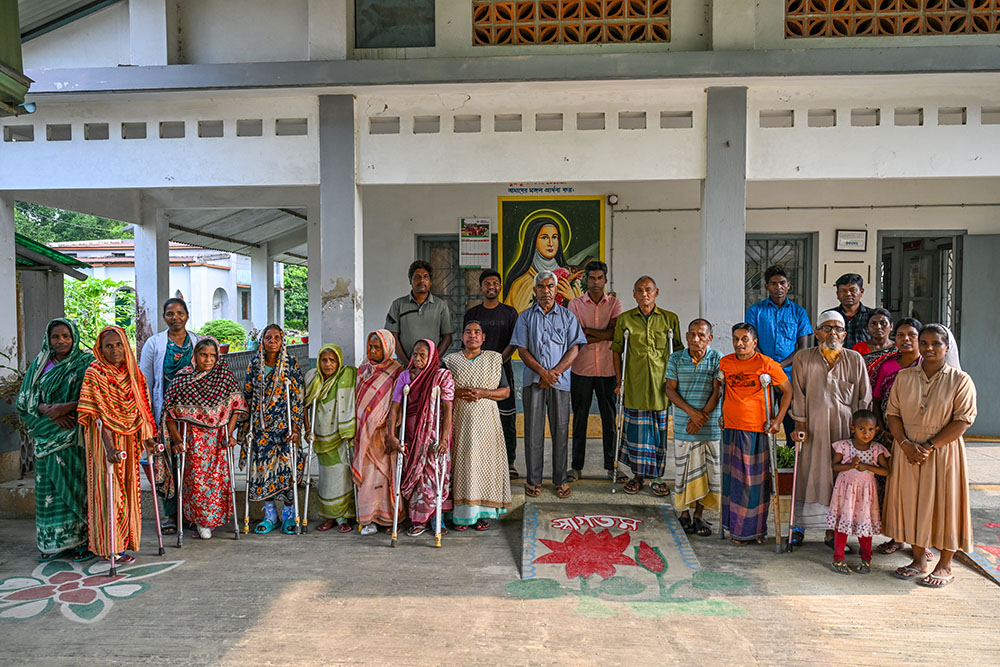 Patients and staff pose for a group portrait. Together, they represent a resilient community dedicated to a leprosy-free future. (Piyas Biswas)