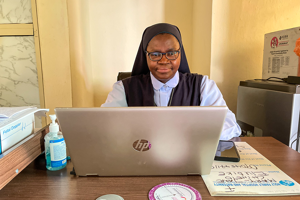 Sr. Dr. Uzoma Maria-Joannes works in her office at Holy Family Hospital and Maternity in Owerri, Nigeria. (John Chukwu)