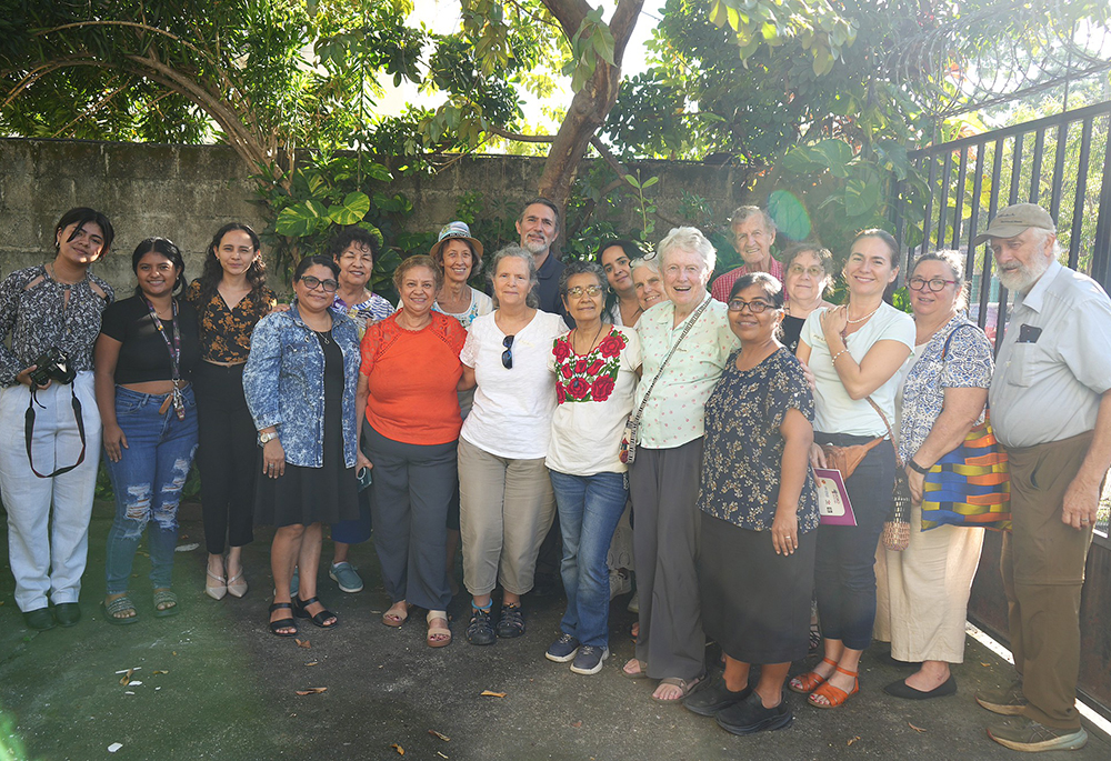Sr. Anita Cleary, fourth from right, poses with delegation members in Honduras. Cleary took a recent pilgrimage to El Salvador and Honduras, sponsored by the SHARE Foundation and the Leadership Conference for Women Religious. (Courtesy of Anita Cleary)