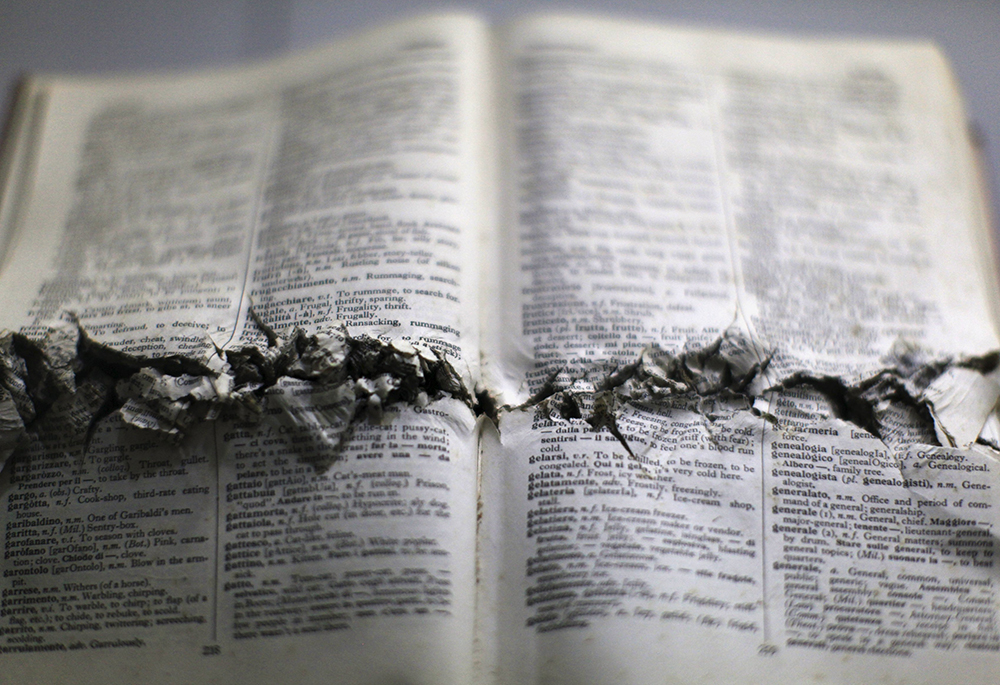 A book of one of the six Jesuit priests killed in El Salvador in 1989 is exhibited at the Museum of the Central American University in San Salvador Jan. 6, 2016. (CNS/Reuters/Jose Cabezas)