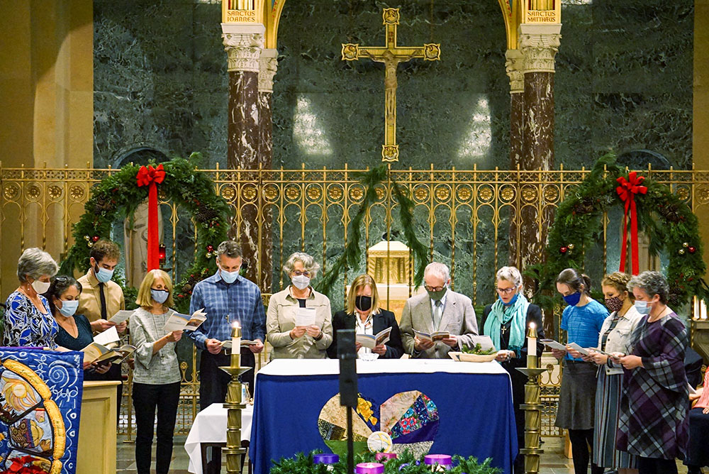 New Maryknoll lay missioners recite their "Commitment Prayer" at the Queen of Apostles Chapel in Ossining, N.Y., Dec. 11, 2021. The formation program prepared the missioners for cross-cultural ministries in six countries: Bolivia, Brazil, El Salvador, Kenya, Tanzania and the U.S.-Mexico border. (CNS/Courtesy of Maryknoll Lay Missioners/Pat Norberto)