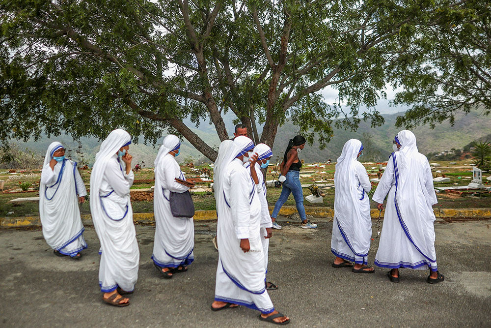 Members of the Missionaries of Charity walk after accompanying a burial for earthquake victims at La Esperanza Cemetery in La Guaira, Venezuela, July 6, 2026. Two catastrophic earthquakes hit Venezuela in quick succession June 24, leaving at least 3,500 dead, which experts say is a major undercount. (OSV News/Reuters/Adriano Machado)