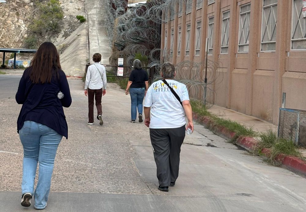 Catholic Sisters Walking with Migrants participants walk alongside the U.S. wall at the Morley Port of Entry in Nogales, Arizona. (Eileen McKenzie)