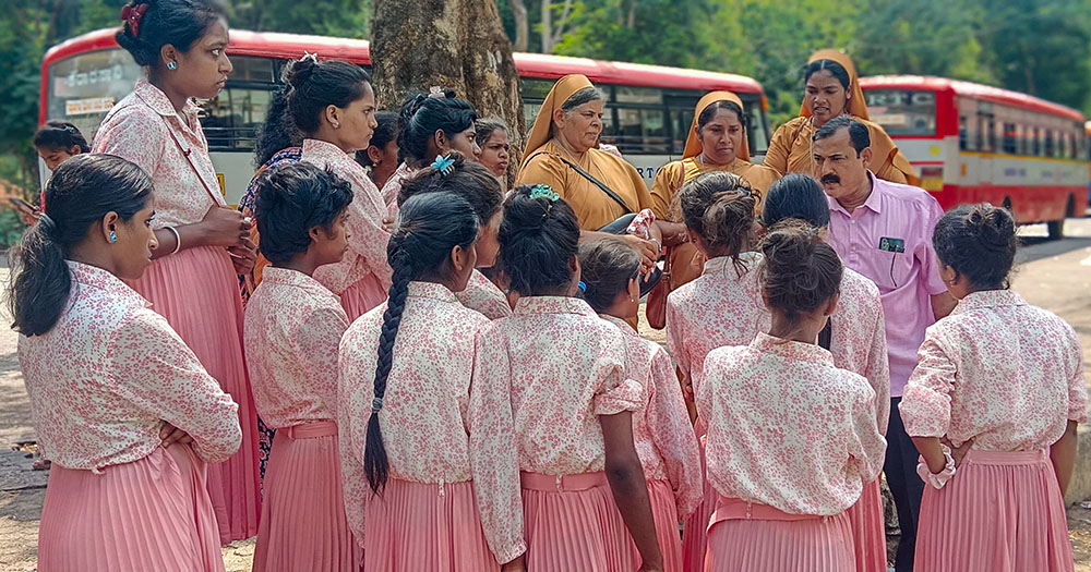 Vivek Vincent Pais, the director of Dharmasthala, a Jain center in Mangaluru, southern India, explains its history to children from the Infant Jesus Children's Home, while Sisters Veronica, Ashly and Aneesha accompany them. (Thomas Scaria)