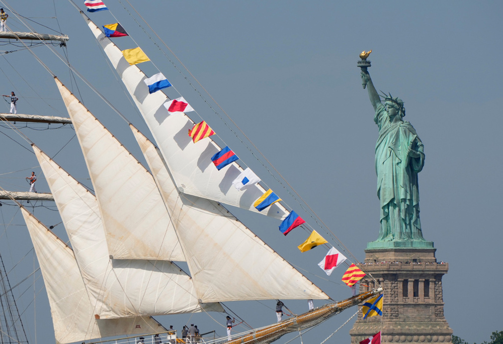 The Statue of Liberty is seen as Argentina's Ara Libertad sails past in the New York harbor during the International Parade of Sail, part of Sail250, a gathering of tall ships and military ships, Saturday, July 4, 2026, in New York. (AP photo/Yuki Iwamura)