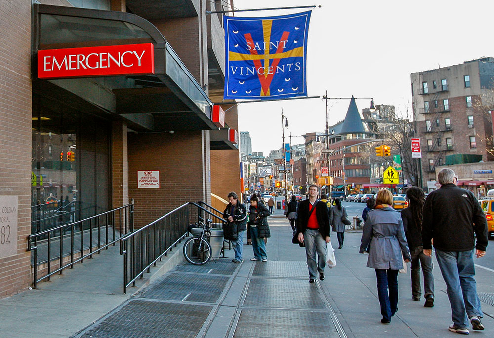 Pedestrians walk past the emergency entrance at St. Vincent's Hospital in New York, March 16, 2010. The 160-year-old hospital closed later that year. (AP/Kathy Willens)