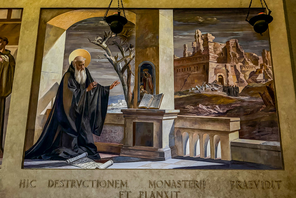 A fresco in the cell of St. Benedict at the Monastery of Monte Cassino in Italy depicts Benedict weeping after foreseeing the destruction of the monastery. The Latin inscription reads, "Here he foresaw and wept over the destruction of the monastery." (GSR photo/Helga Leija)