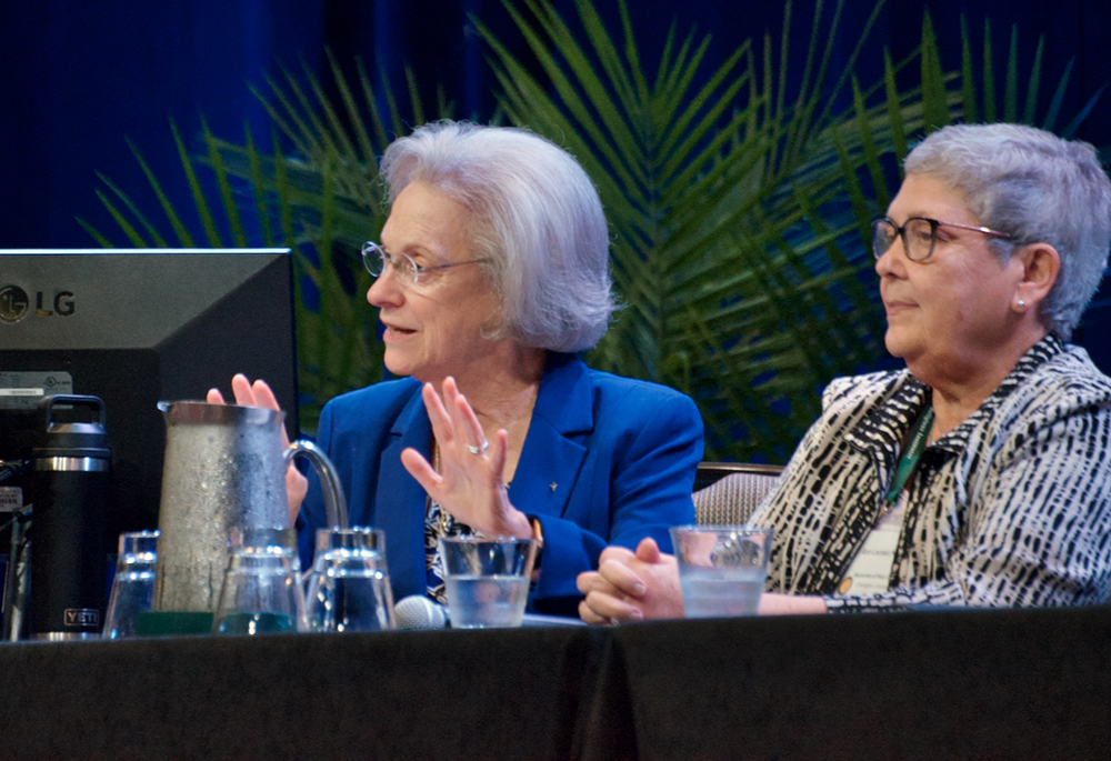 Sr. Sharon Euart, left, speaks during a panel on pontifical commissaries Oct. 2, 2025, at the Resource Center for Religious Institutes annual conference in Dallas. Euart is the organization’s executive director; at right is Sr. Ann Lacour of the Marianites of Holy Cross, the first sister appointed commissary in the U.S. (GSR photo/Dan Stockman)