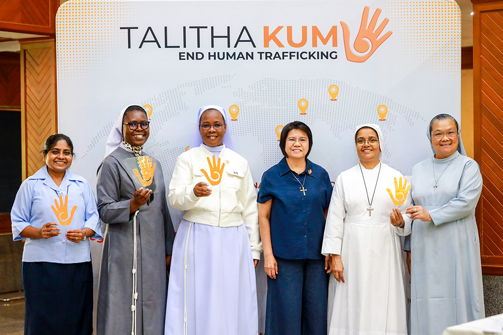 Sr. Abby Avelino (in dark blue), coordinator of the anti-trafficking coalition Talitha Kum, is joined by a group of sisters from Bangladesh, Kenya, Cameroon and Myanmar during the coalition's leadership training program June 24-29, 2026, in Bangkok. (Courtesy of Talitha Kum)