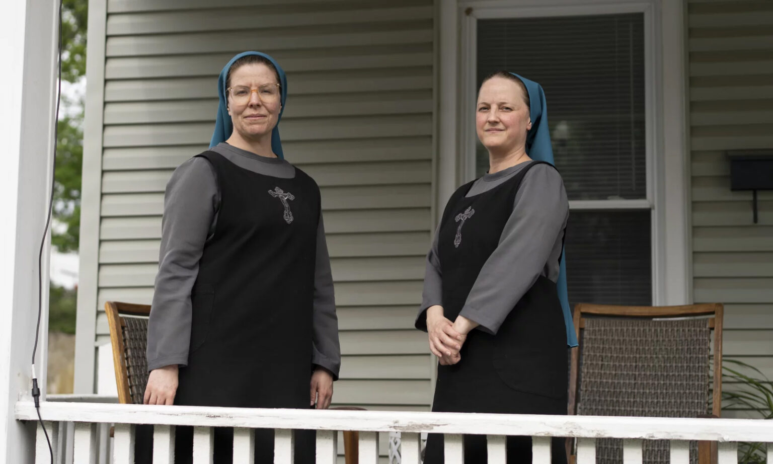 Sister Danielle Lussier, left, and Sister Theresa Aletheia pose for a portrait on the front porch of their home on April 27, 2026, in Mt. Sterling, Ky
