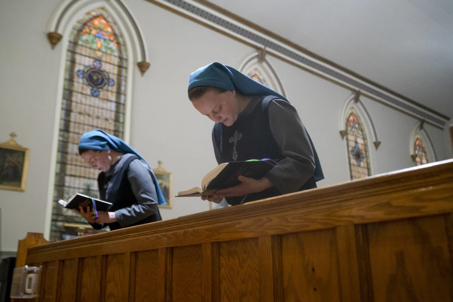 Sister Danielle Lussier, left, and Sister Theresa Aletheia, Sisters of the Little Way, sing morning prayers in the chapel next to their home on April 27, 2026, in Mt. Sterling, Ky. (RNS/NPR/Natosha Via)
