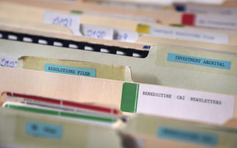 Close-up on tabs of manilla files folders. 