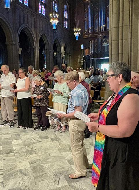 Kate Gillooly, minister at Heights Christian Church (Disciples of Christ) can be seen in the foreground at the Cleveland interfaith prayer in solidarity with migrants on June 24. (Christine Schenk)