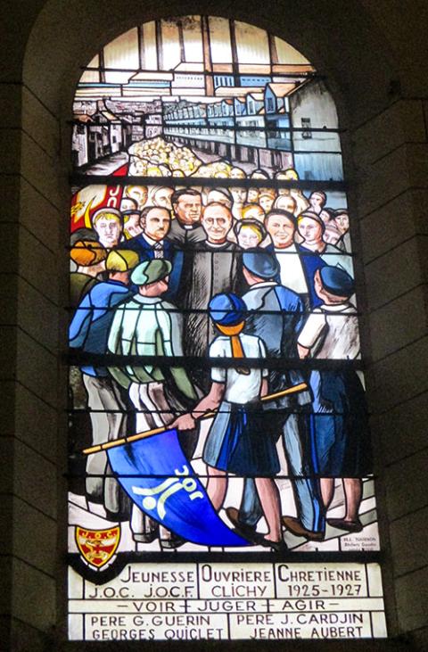 A stained glass window in Saint-Vincent-de-Paul de Clichy Church in France honors the Young Christian Workers, founded as the Young Trade Unionists in the early 20th century. (Wikimedia Commons/Thomon)