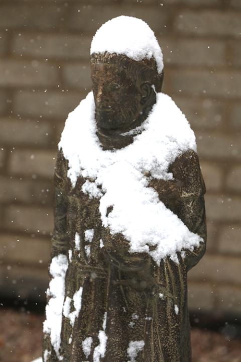 Snow covers a statue of St. Francis of Assisi outside Sacred Heart Church following a winter storm in Prescott, Arizona, Jan. 7, 2024. (OSV News/Bob Roller)