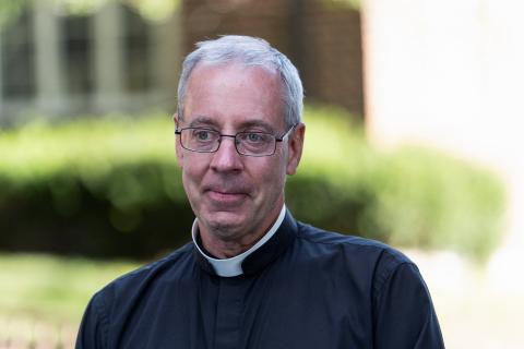 Father Dennis Zehren, pastor of Annunciation Church in Minneapolis, becomes emotional as he speaks to the media Aug. 30, 2025