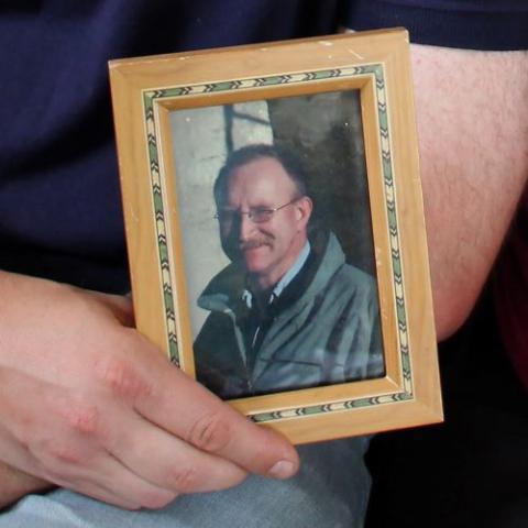 Matt Morrison holds a framed picture of his father, Matthew.