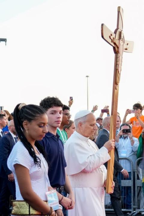 Pope Leo XIV carries the Jubilee Cross.