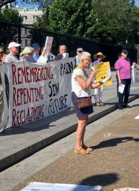 Marie Dennis speaks at vigil.