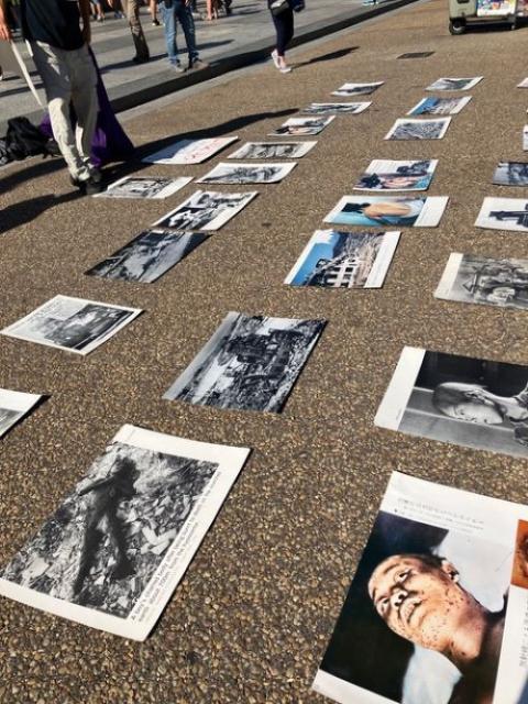 Photos of atomic bomb victims on sidewalk