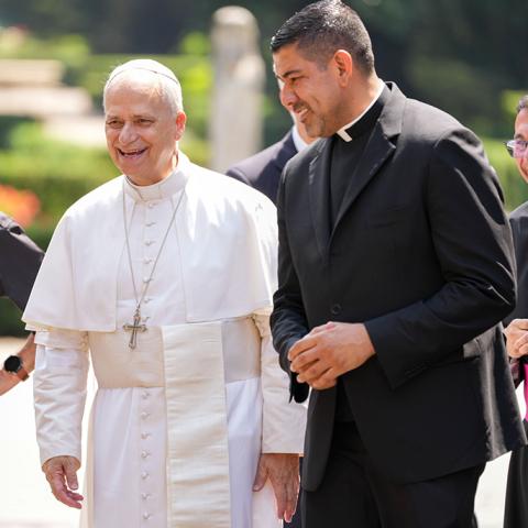 Pope Leo XIV walks with Fr. Manuel Dorantes, a priest of the Archdiocese of Chicago at the Borgo Laudato Si’ in Castel Gandolfo, Italy, Aug. 17, 2025. (CNS/Lola Gomez)