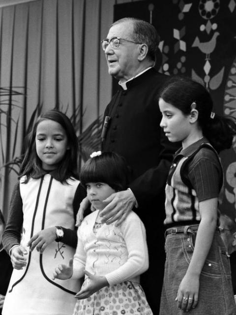 Opus Dei's founder, Fr. Josemaría Escrivá de Balaguer y Albás, is pictured with children in this undated photo. (OSV News/Courtesy Opus Dei)