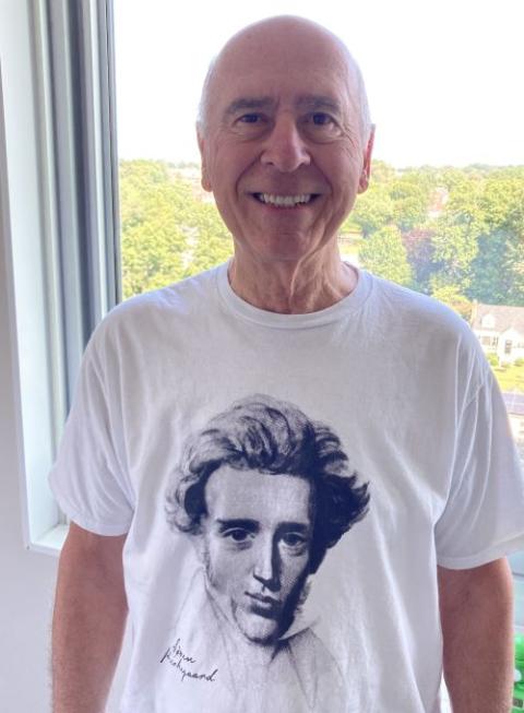 Michael Leach wears a T-shirt depicting the Danish philosopher Soren Kierkegaard. 