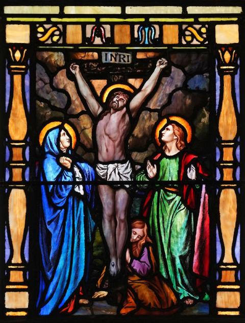 Christ's crucifixion is depicted in a stained-glass window at St. Mary of the Isle Church in Long Beach, N.Y. (CNS/Gregory A. Shemitz)